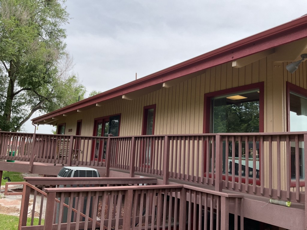 Commercial red gutters on a commercial building rooftop